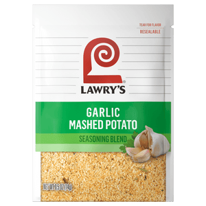 ["A Lawry's Garlic Mashed Potato Seasoning Blend packet with a close-up of the seasoning and garlic cloves."]