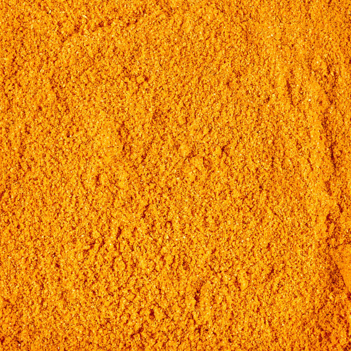 A close-up of vibrant orange turmeric powder.