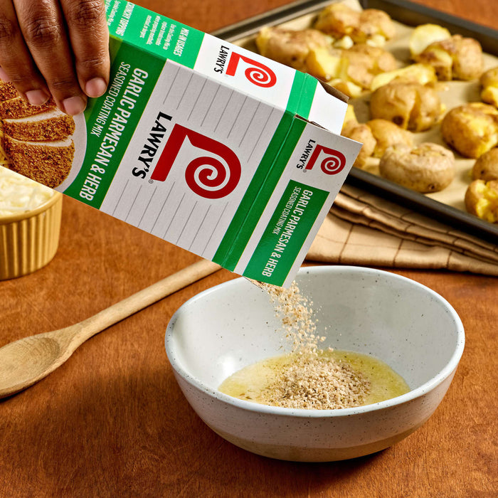 A hand pours Lawry's Seasoned Salt into a bowl, likely for seasoning potatoes.