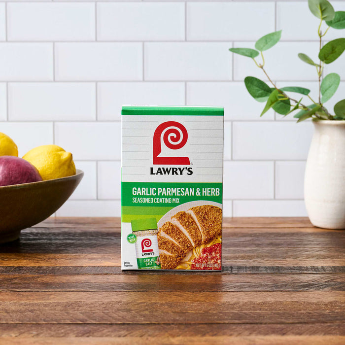 A box of Larry's Sweetcream Layer Cake mix is displayed on a wooden surface.