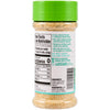 A bottle of a spice blend with a green lid shows the nutrition facts and ingredients.
