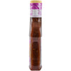 A bottle of Momofuku Chili Crunch is displayed, showcasing its vibrant red color and visible chili flakes.