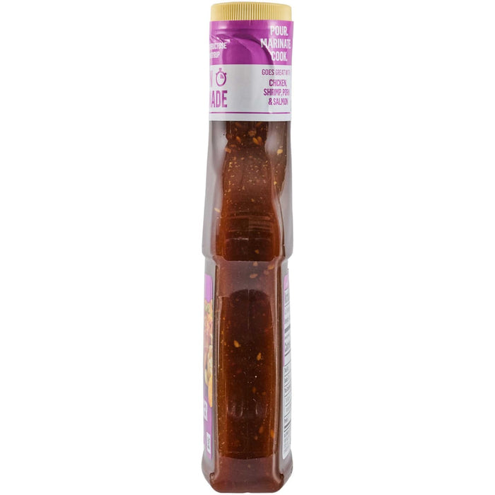 A bottle of Momofuku Chili Crunch is displayed, showcasing its vibrant red color and visible chili flakes.