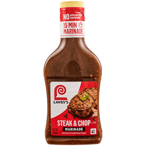 A bottle of Lawry's Steak &amp; Chop Marinade with garlic and cracked black pepper, boasting natural flavors and no high fructose corn syrup, ready in just 15 minutes.