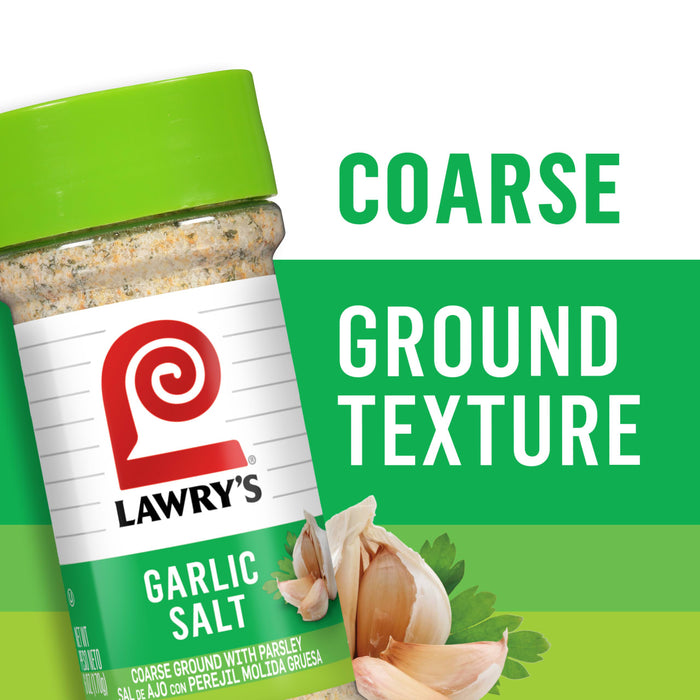 ["A jar of Lawry's Garlic Salt with a close-up of garlic cloves and parsley."]