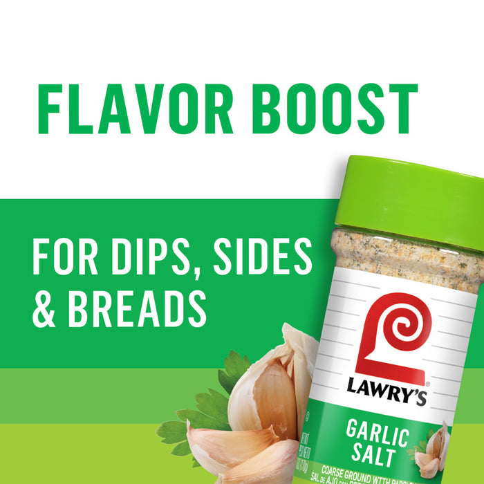 ["A jar of Lawry's Garlic Salt with a garlic clove and parsley in the foreground."]