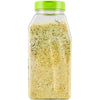 ['A clear plastic bottle with a green lid filled with a yellow and green seasoning.']