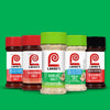 A collection of Lawry's seasoned salts and garlic salt bottles are displayed against a green background.