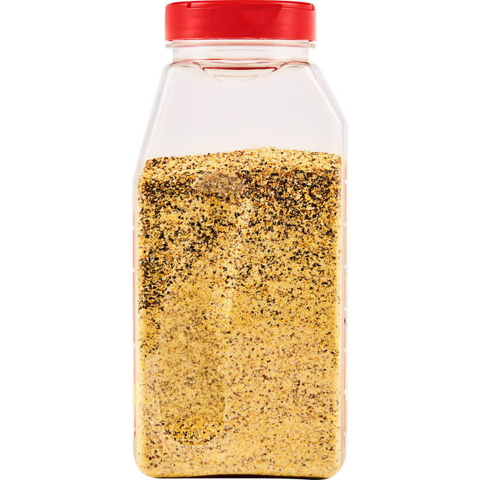 ['A clear plastic jar with a red lid filled with a yellow and brown spice blend.']