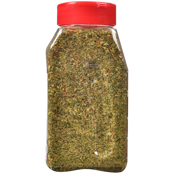 ['A glass jar with a red lid filled with a blend of herbs and spices.']