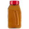['A glass jar with a red lid filled with a yellow powder.']