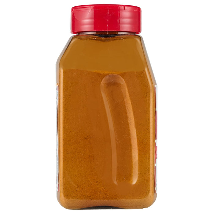 ['A glass jar with a red lid filled with a yellow powder.']