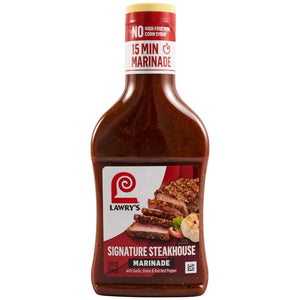 A bottle of Lawrys Steakhouse Marinade, Lawry's Signature Steakhouse Marinade with Garlic, Onion &amp; Red Bell Pepper, highlights 'No High Fructose Corn Syrup' and '15 Min Marinade' on its label, which also shows a sliced steak.