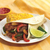 A delicious-looking beef fajita with corn on the cob and a side of salsa is presented on a white plate.