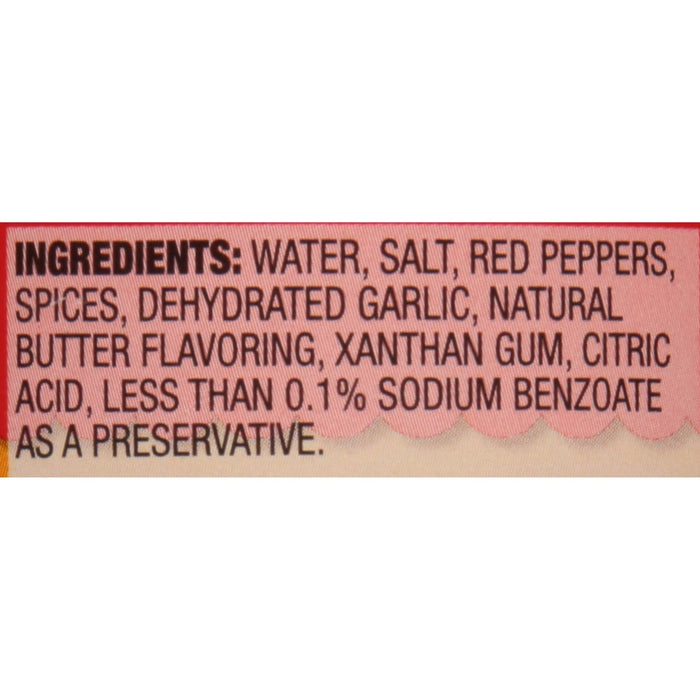 ['The ingredients for the product are listed on a red and white label.']