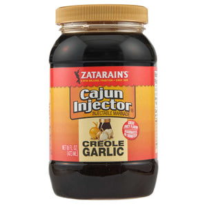["A bottle of Zatarain's Cajun Injector Creole Garlic marinade."]