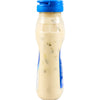 A bottle of Hidden Valley Ranch dressing with a blue cap.