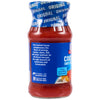 A side view of a glass jar containing Mccormick Cocktail Cocktail Sauce Original 8 Oz featuring a blue label that highlights its flavor profile and pairing suggestions for seafood.