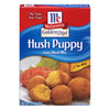 ['A box of McCormick Golden Dipt Hush Puppy Corn Meal Mix with a serving suggestion of fried hush puppies.']