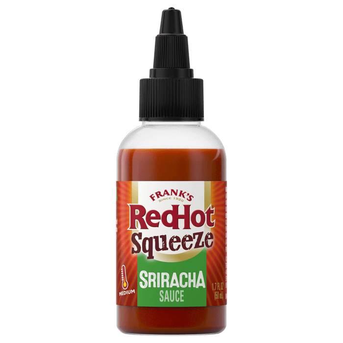["A bottle of Frank's RedHot Sriracha Squeeze Sauce."]