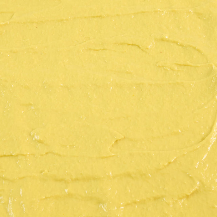 A smooth, yellow spread with subtle ridges and a creamy texture.