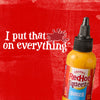 A bottle of Frank\s RedHot Squeeze Burger Sauce with the tagline I put that on everything on a red background.