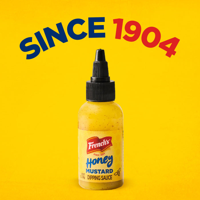 A bottle of Frenchs Honey Mustard Dipping Sauce established since 1904 against a yellow background.