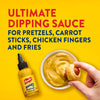 A bottle of French's Honey Mustard Dipping Sauce is shown with a bowl of the sauce and a hand dipping a pretzel dog into it, under the text "Ultimate Dipping Sauce for Pretzels, Carrot Sticks, Chicken Fingers and Fries."