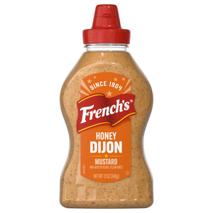 A squeeze bottle of French'S Honey Dijon Mustard Gluten Free, featuring an orange label with the brand name in red script and 'Since 1904' at the top.