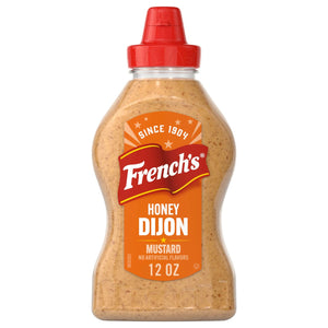 A 12 oz squeeze bottle of Frenchs Brown Honey Dijon Mustard 12 Oz featuring a red flip top cap and a vibrant orange label with the brand logo.