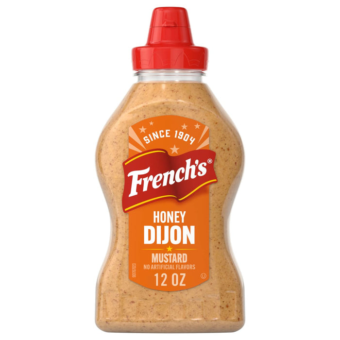 A 12 oz squeeze bottle of Frenchs Brown Honey Dijon Mustard 12 Oz featuring a red flip top cap and a vibrant orange label with the brand logo.