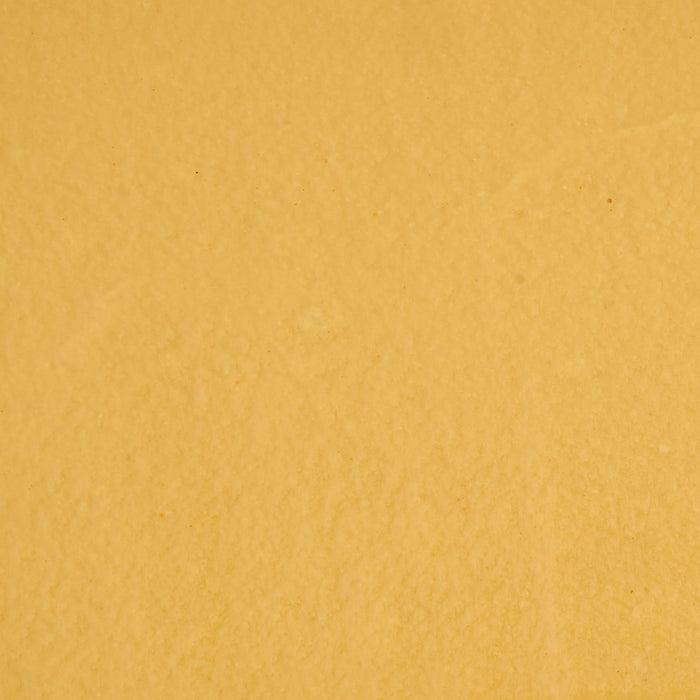 A close-up, textural shot of the smooth, golden-brown Frenchs Brown Honey Mustard 12 Oz.