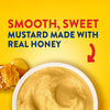 An advertisement for Frenchs Brown Honey Mustard 12 Oz shows a bowl of the smooth, sweet mustard next to a piece of real honeycomb to highlight its ingredients.