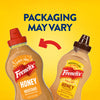 An informational image displays two versions of Frenchs Brown Honey Mustard 12 Oz to show that the packaging may vary, with an arrow indicating the change from the old design to the new.