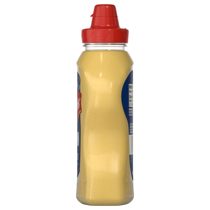 A bottle of Frenchs Beige Dijon Chardonnay Mustard 12 Oz stands upright, showcasing its yellow contents and black squeeze cap against a white background.