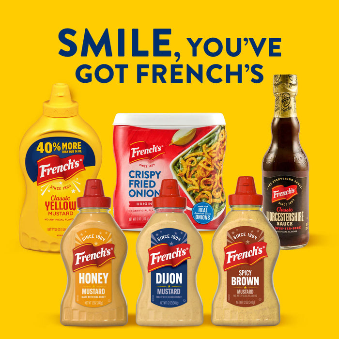 A collection of French's products, including Classic Yellow Mustard, Crispy Fried Onions, Worcestershire Sauce, Honey Mustard, Spicy Brown Mustard, and a bottle of Frenchs Beige Dijon Chardonnay Mustard 12 Oz, are arranged under the slogan SMILE, YOU'VE GOT FRENCH'S.