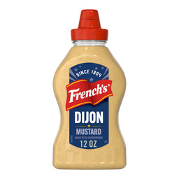 A clear plastic squeeze bottle of Frenchs Beige Dijon Chardonnay Mustard 12 Oz is shown against a white background.