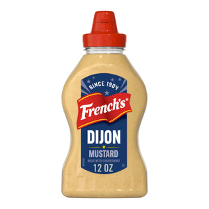 A clear plastic squeeze bottle of Frenchs Beige Dijon Chardonnay Mustard 12 Oz is shown against a white background.