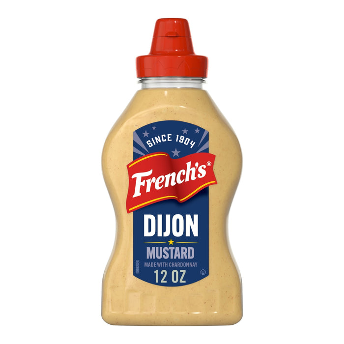 A clear plastic squeeze bottle of Frenchs Beige Dijon Chardonnay Mustard 12 Oz is shown against a white background.