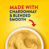 A red arrow points from the text MADE WITH CHARDONNAY &amp; BLENDED SMOOTH to a white bowl filled with the creamy Frenchs Beige Dijon Chardonnay Mustard 12 Oz, emphasizing its quality ingredients and texture.