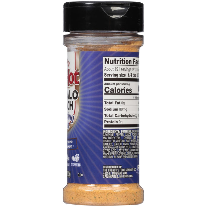 A plate of chicken wings with celery sticks, carrots, and blue cheese dip.