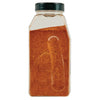 ['A glass jar filled with brown spice.']