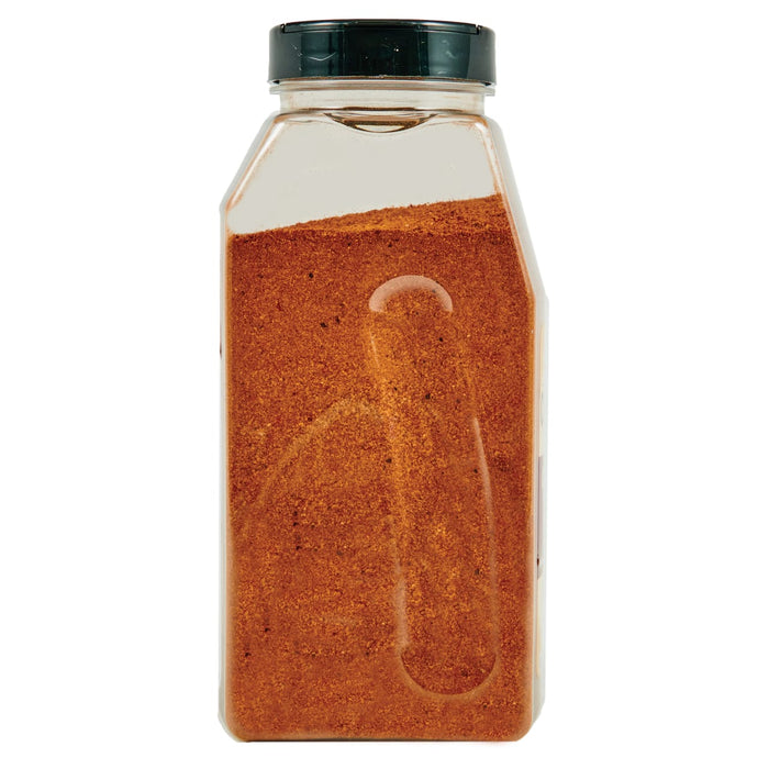 ['A glass jar filled with brown spice.']