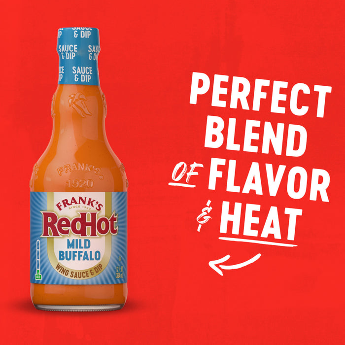 A bottle of Franks Red Hot Regular Wing Hot Sauce Mild 12 Oz is displayed against a vibrant red background with text highlighting it as a perfect blend of flavor and heat.