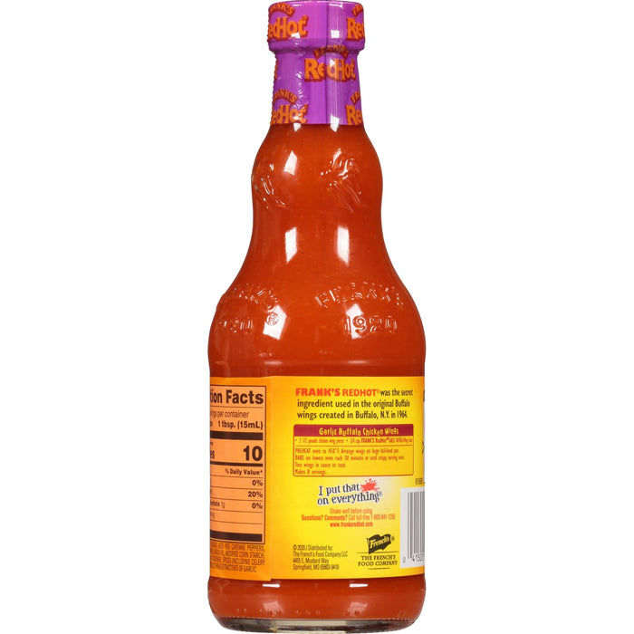 ["A bottle of Frank's RedHot Original Hot Sauce with nutritional information and instructions for making garlic buffalo chicken wings."]