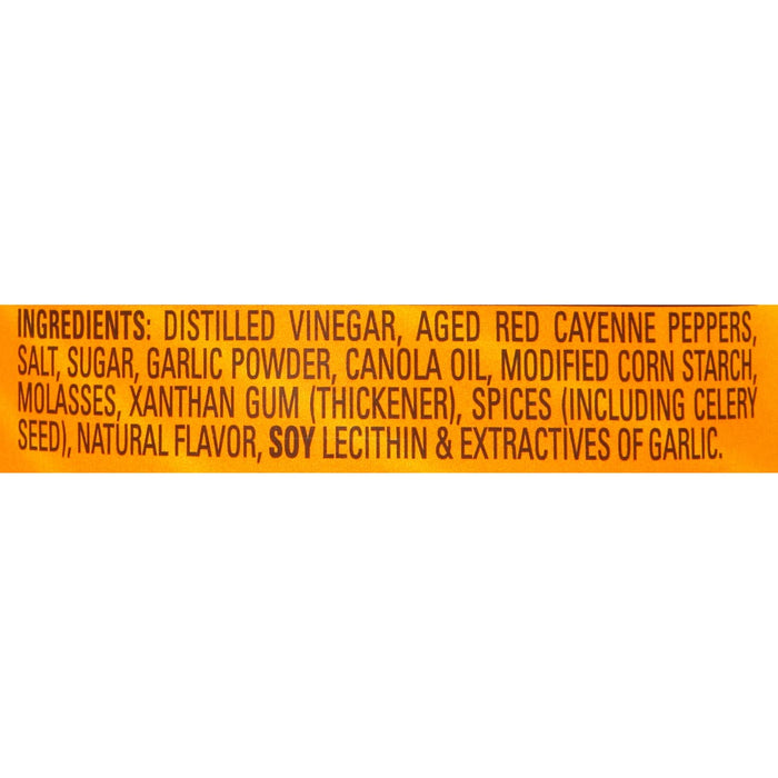 ['A list of ingredients for a product, including distilled vinegar, aged red cayenne peppers, salt, sugar, garlic powder, canola oil, modified corn starch, molasses, xanthan gum, spices, natural flavor, soy lecithin, and extractives of garlic.']