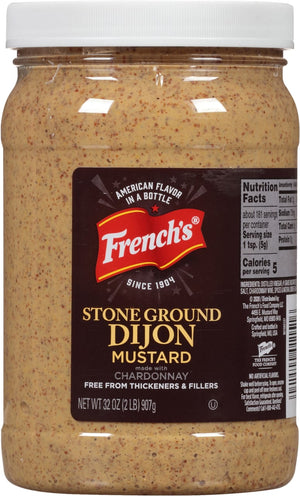 ["A jar of French's Stone Ground Dijon Mustard made with Chardonnay."]