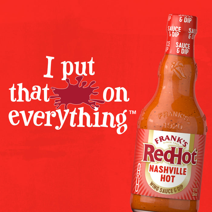 An advertisement for Franks Red Hot Regular Wing Hot Sauce Hot 12 Oz features the bottle against a vibrant red background with the slogan I put that on everything.