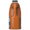 A side view of a large jug of Franks Red Hot Regular Wing Hot Sauce Mild 128 Oz highlights the container's built-in handle and the orange sauce within.