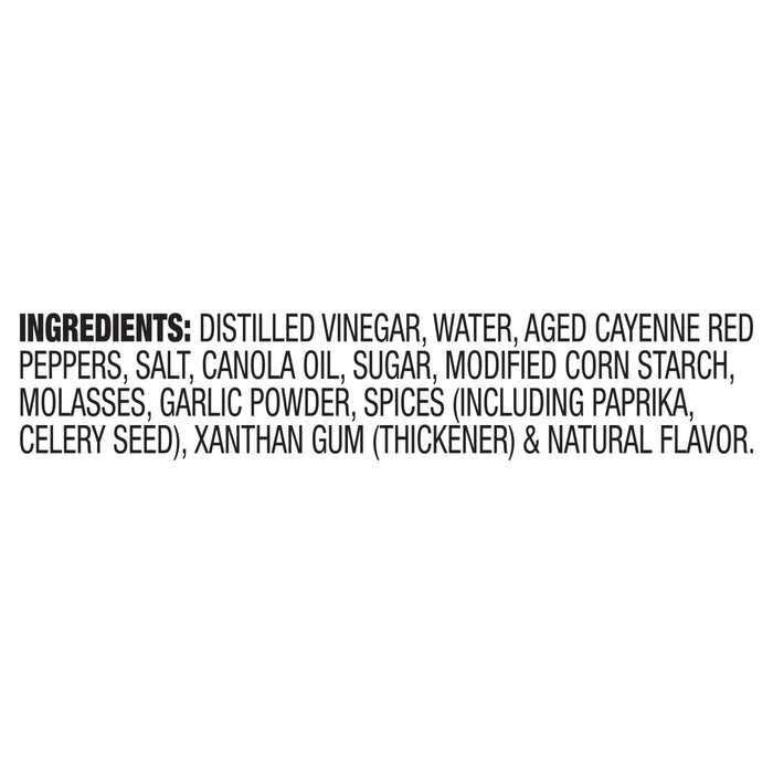 The ingredients list for Franks Red Hot Regular Wing Hot Sauce Mild 128 Oz is displayed in black text on a white background, detailing components like distilled vinegar, aged cayenne red peppers, and spices.